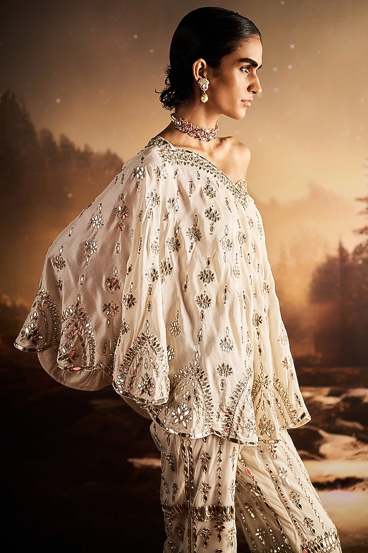 Ivory Silk Sequins Embroidered One-Shoulder Cape Set by Rococo By Raghvi at Pernia's Pop Up Shop
