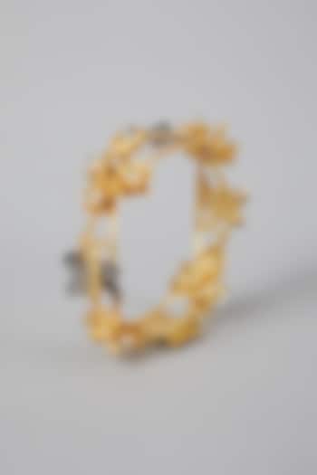 Gold Finish Floral Motifs Bangle by Rohita And Deepa at Pernia's Pop Up Shop