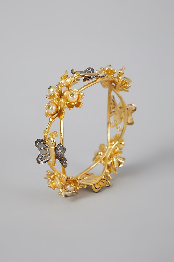 Gold Finish Floral Motifs Bangle by Rohita And Deepa at Pernia's Pop Up Shop