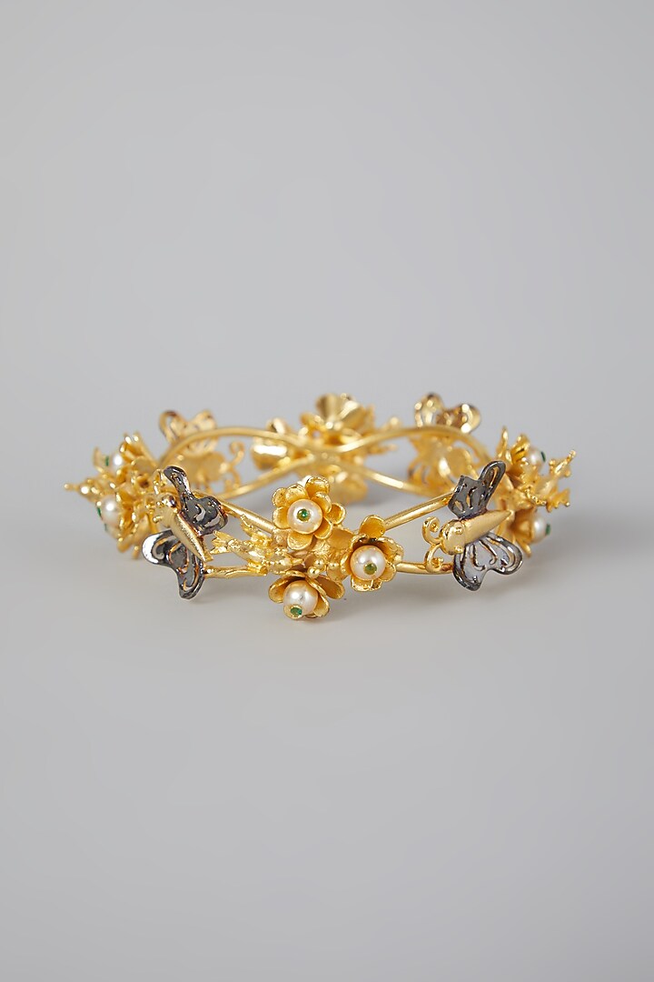 Gold Finish Floral Motifs Bangle by Rohita And Deepa at Pernia's Pop Up Shop