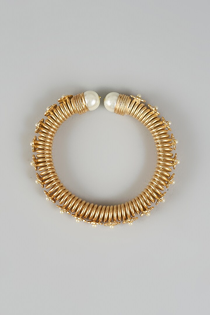 Gold Finish Pearl Knob & Floral Motifs Bracelet by Rohita and Deepa at Pernia's Pop Up Shop
