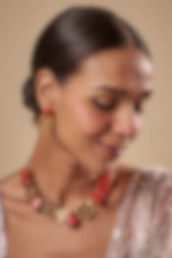 Gold Finish Floral Motifs & Coral Stone Necklace Set by Rohita and Deepa at Pernia's Pop Up Shop