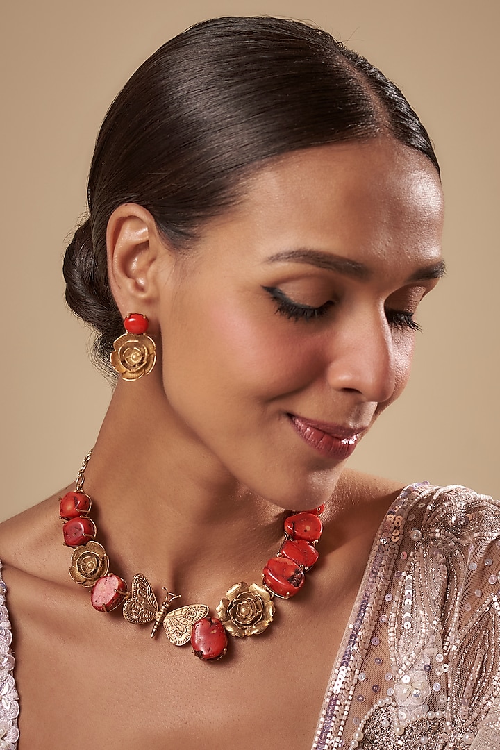 Gold Finish Floral Motifs & Coral Stone Necklace Set by Rohita and Deepa at Pernia's Pop Up Shop