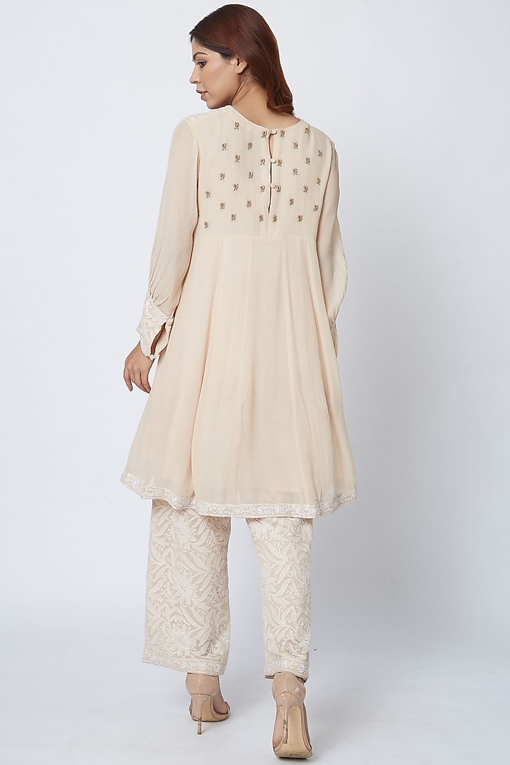 Beige Hand Embroidered Palazzo Pant Set by Romaa at Pernia's Pop Up Shop