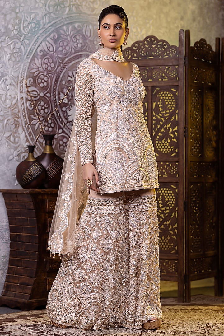 Cream Net Sequins & Cutdana Embroidered Gharara Set by RAJ ARORA ROOP VATIKA at Pernia's Pop Up Shop