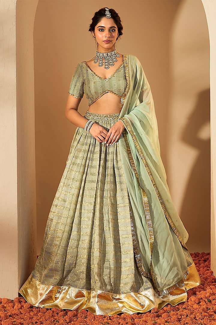 Sage Green Silk Chanderi & Silk Organza Sequins Hand Embroidered Wedding Lehenga Set by Rooh By Ridhimaa at Pernia's Pop Up Shop