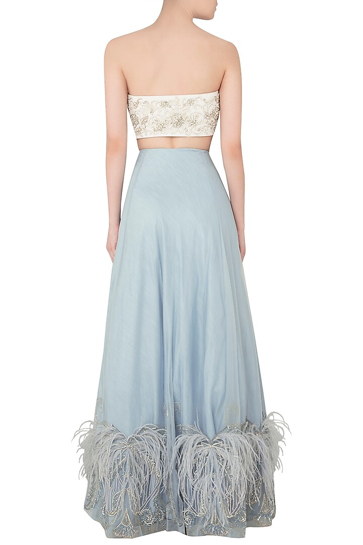 Off white embroidered bustier with sky blue lehenga skirt available only at Pernia's Pop Up Shop.