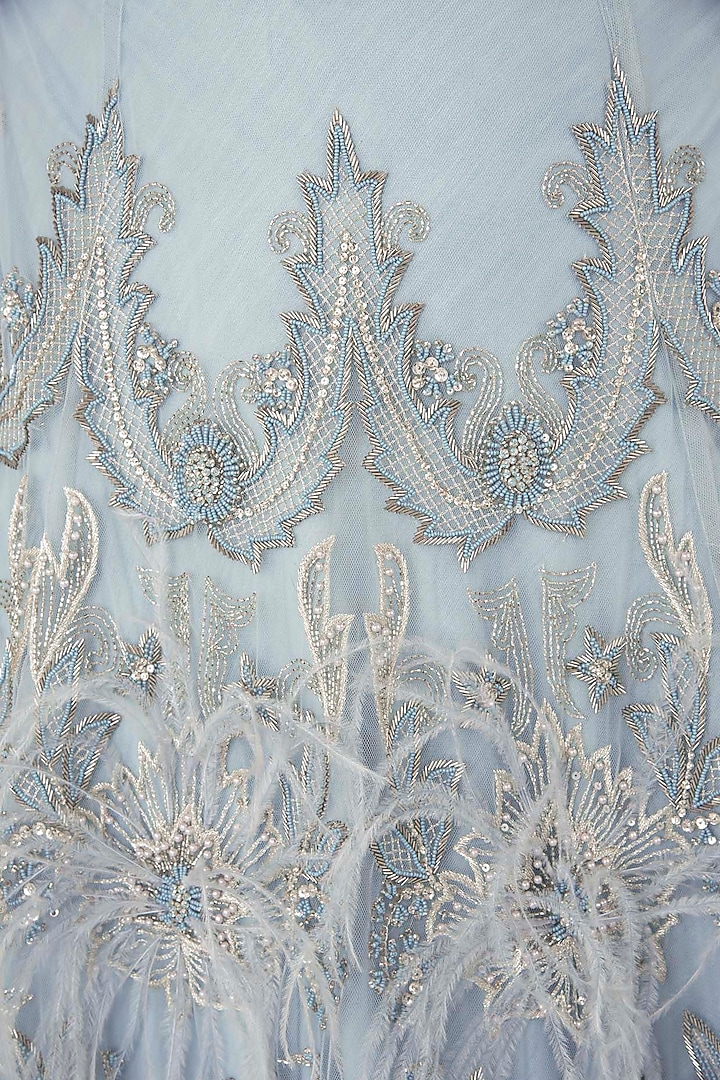 Off white embroidered bustier with sky blue lehenga skirt available only at Pernia's Pop Up Shop.
