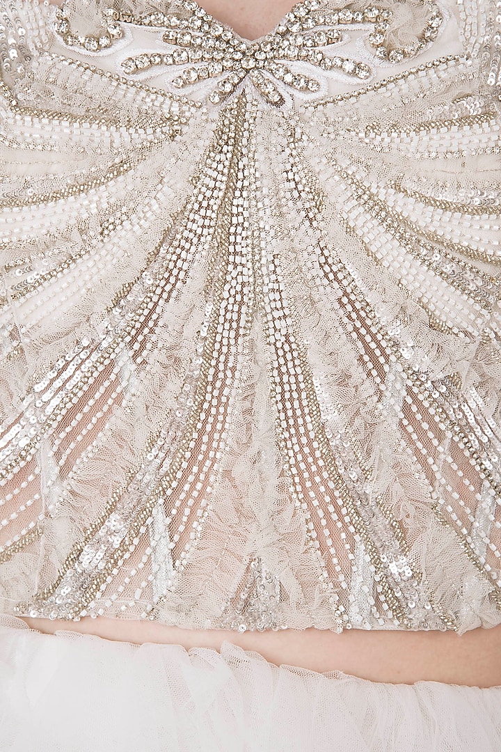 Off white embroidered corset with lehenga skirt available only at Pernia's Pop Up Shop.