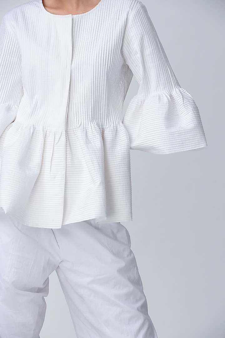 White Pleated Peplum Jacket by Rajesh Pratap Singh at Pernia's Pop Up Shop
