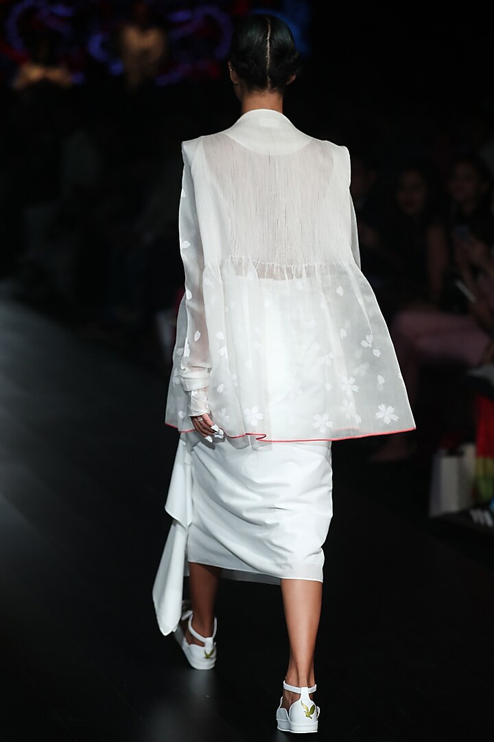 White knotted skirt available only at Pernia's Pop Up Shop.