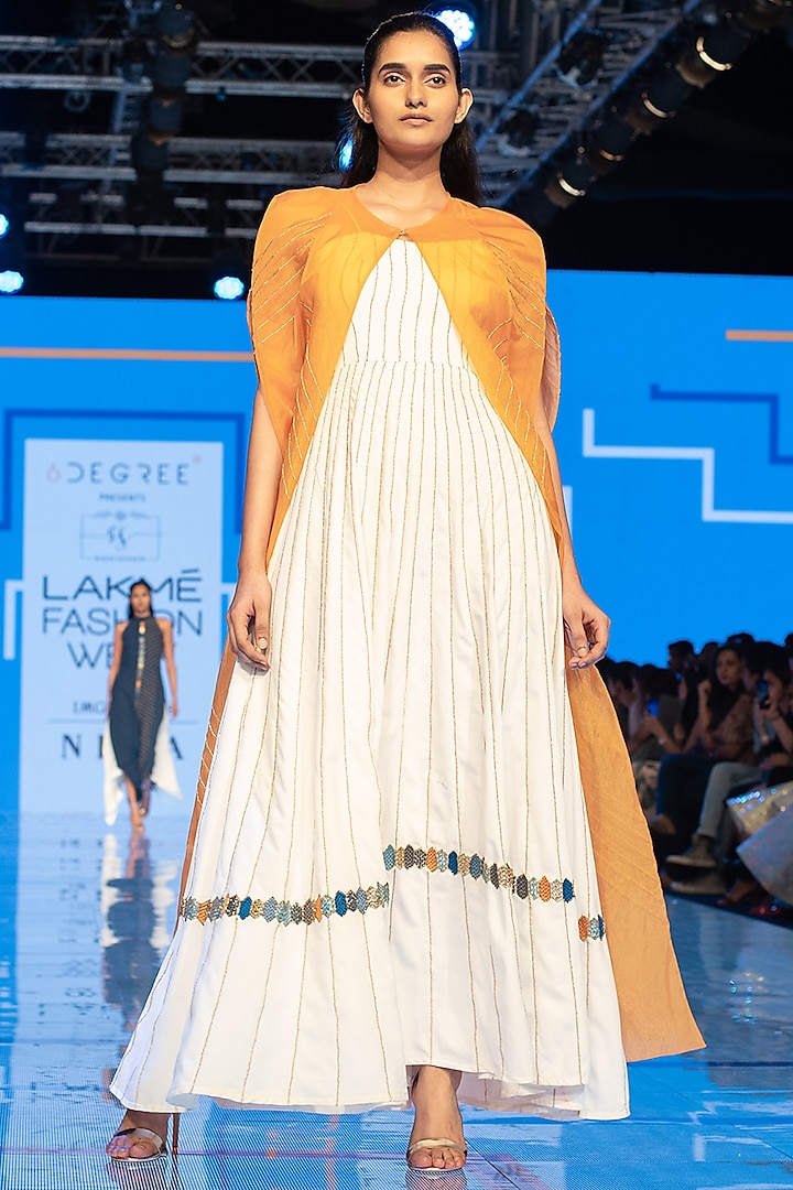 White Embroidered Gown With Yellow Cape by Rajni Suyach