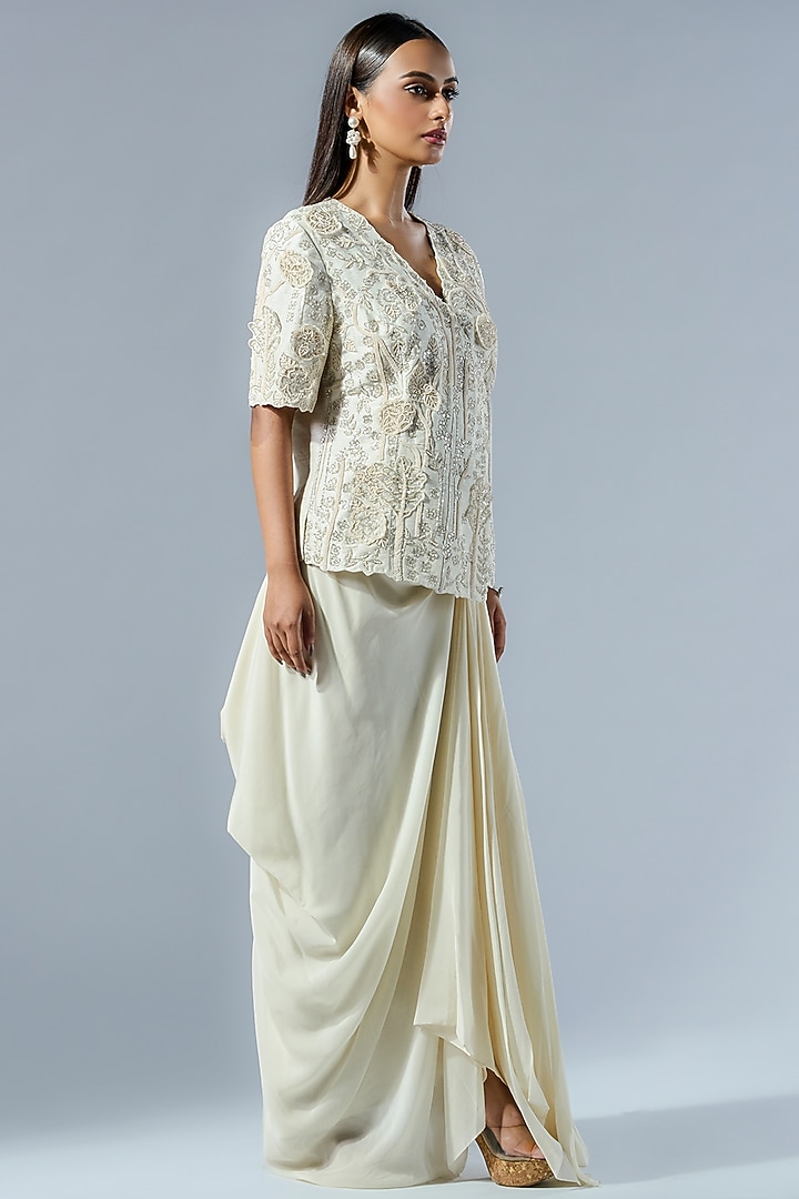 Ivory Crepe 3D Applique Work Draped Skirt Set by Rishi & Soujit at Pernia's Pop Up Shop