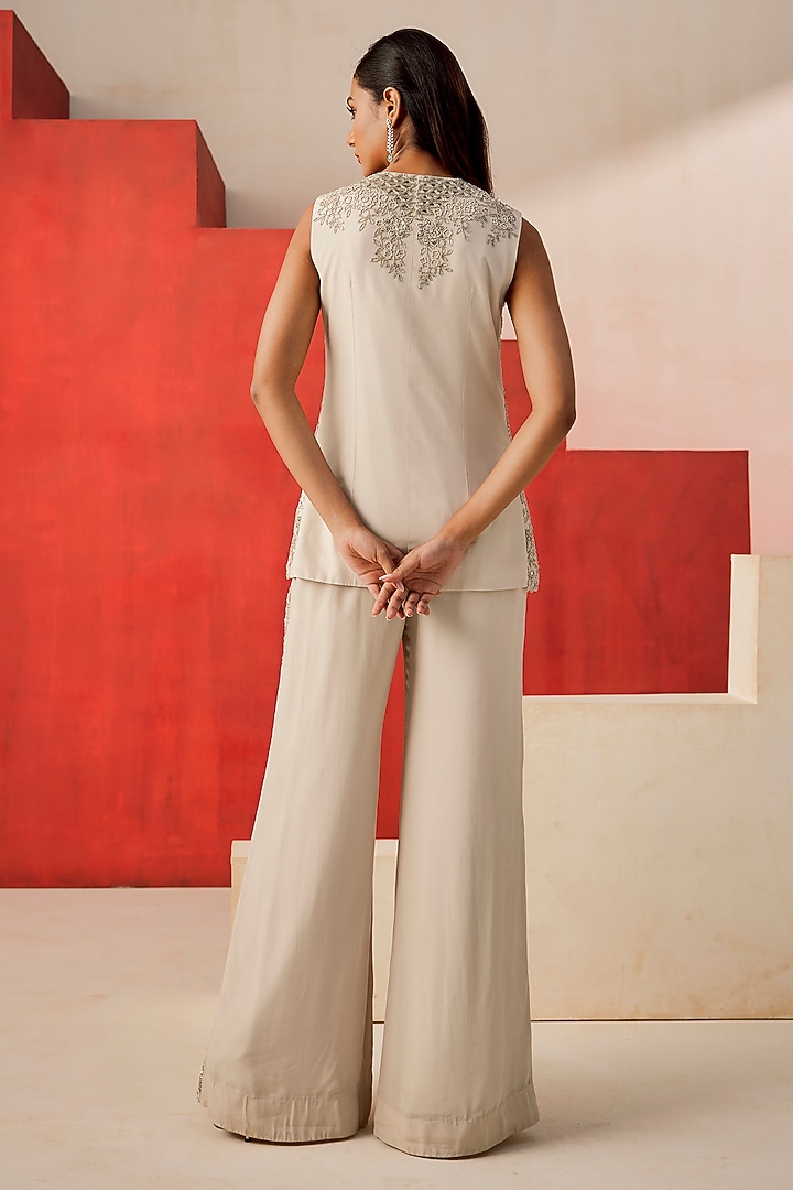 Ivory Crepe Cutdana Embroidered Flared Pant Set by Rishi & Soujit at Pernia's Pop Up Shop