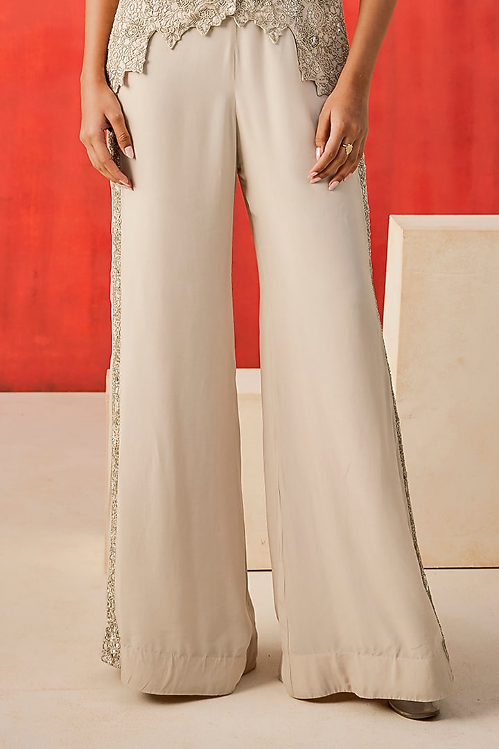 Ivory Crepe Cutdana Embroidered Flared Pant Set by Rishi & Soujit at Pernia's Pop Up Shop