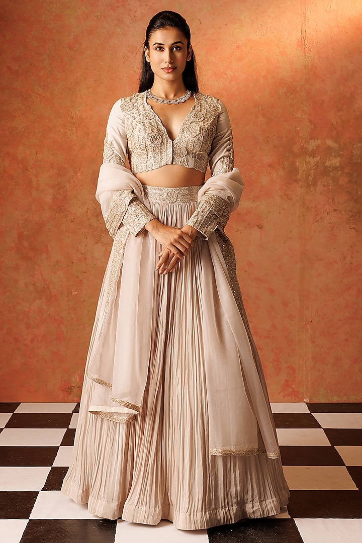 Ivory Crepe Pleated Wedding Lehenga Set by Rishi & Soujit at Pernia's Pop Up Shop