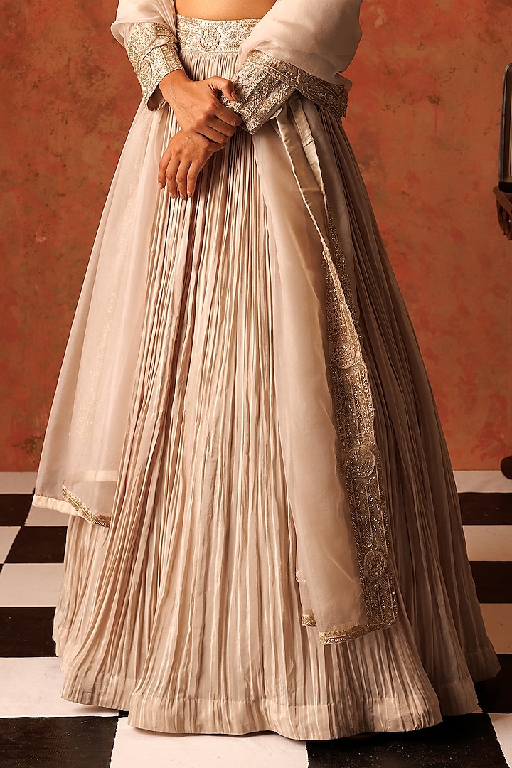 Ivory Crepe Pleated Wedding Lehenga Set by Rishi & Soujit at Pernia's Pop Up Shop