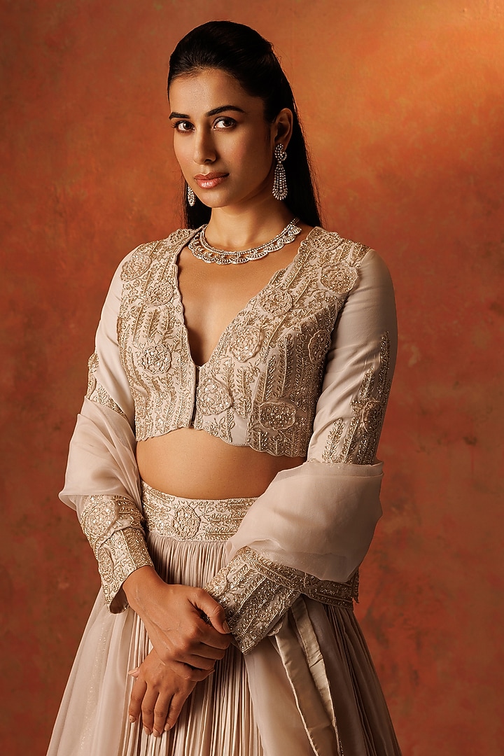 Ivory Crepe Pleated Wedding Lehenga Set by Rishi & Soujit at Pernia's Pop Up Shop