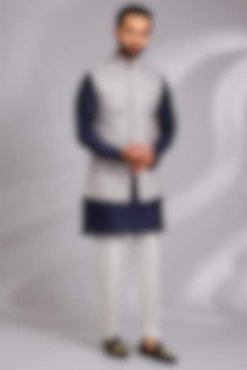 Off-White Linen Silk Tribal Printed Bundi Jacket Set by RNG Safawala Men at Pernia's Pop Up Shop