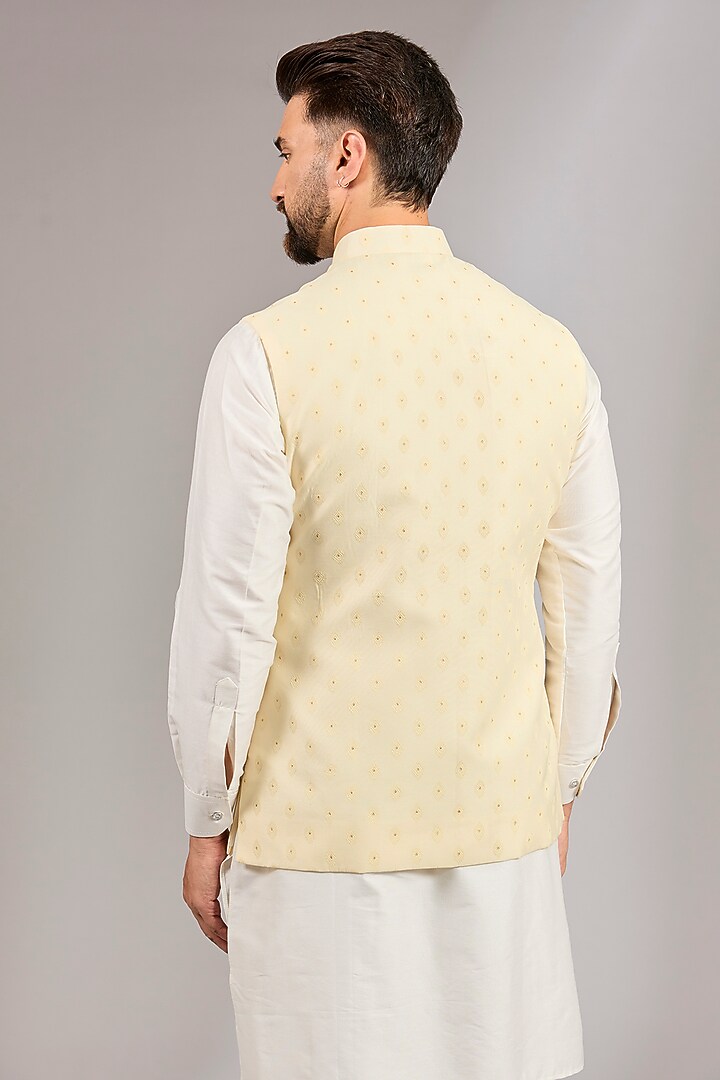 Cream Brocade Silk Motif Embroidered Bundi Set by RNG Safawala Men at Pernia's Pop Up Shop