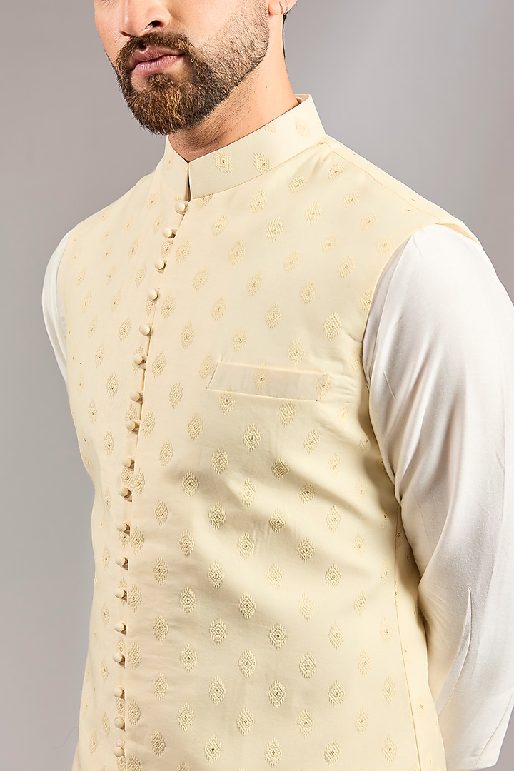 Cream Brocade Silk Motif Embroidered Bundi Set by RNG Safawala Men at Pernia's Pop Up Shop