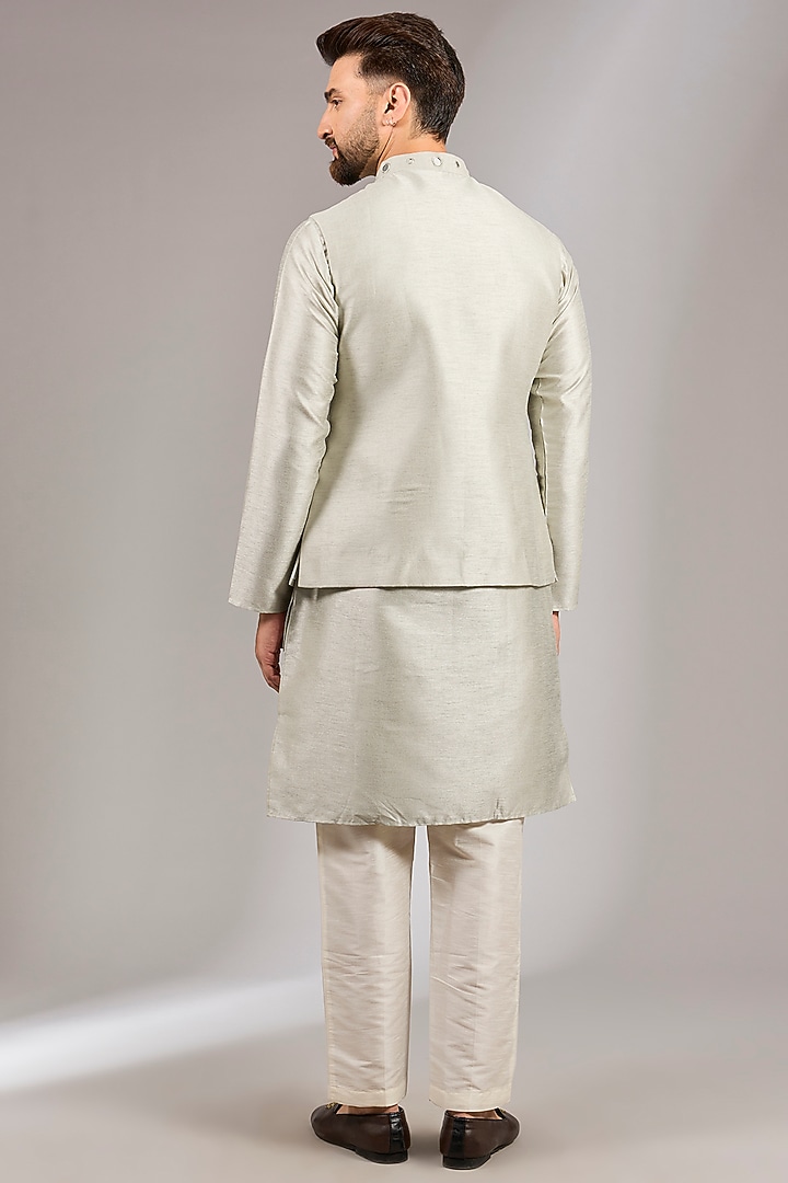 Sage Green Raw Silk MIrror Embroidered Bundi Jacket Set by RNG Safawala Men at Pernia's Pop Up Shop