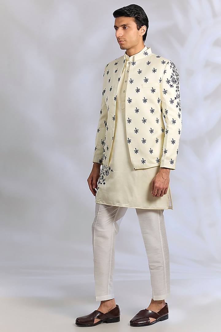 Cream Raw Silk Thread Embroidered Wedding Indowestern Set by RNG Safawala Men at Pernia's Pop Up Shop