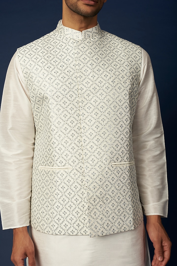 Ivory Linen Silk Thread & Sequins Embroidered Bundi Jacket Set by RNG Safawala Men at Pernia's Pop Up Shop