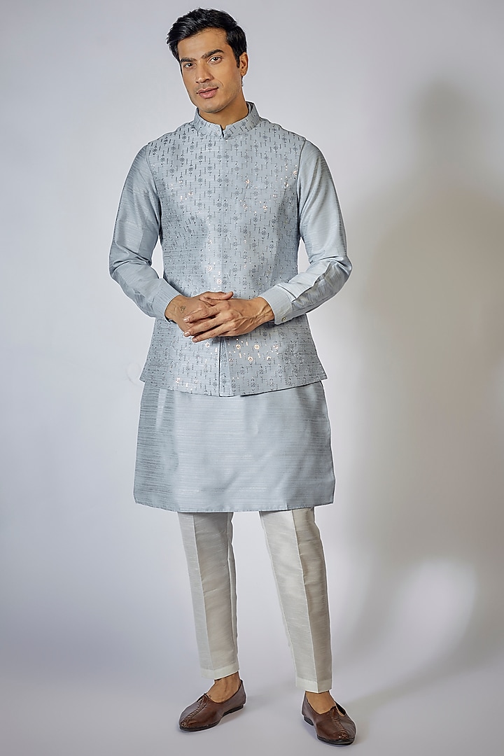 Powder Blue Raw Silk Embroidered Bundi Jacket Set by RNG Safawala Men