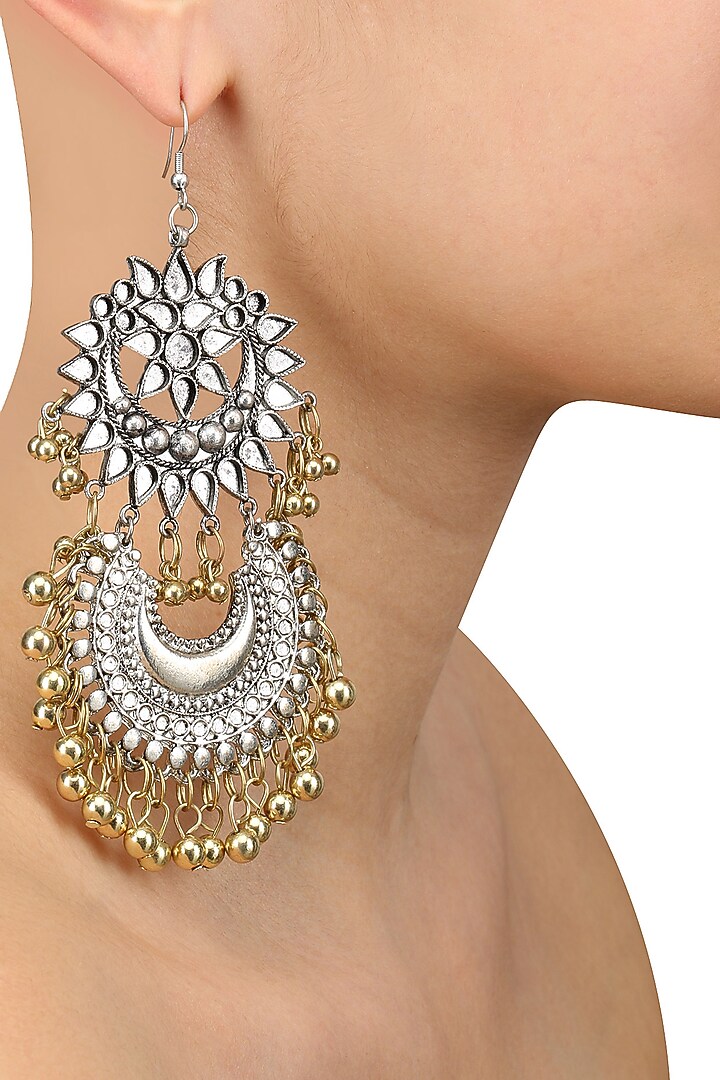 Ritika Sachdeva presents Silver finish floral cutwork crescent gold ghungroo earrings available only at Pernia's Pop Up Shop.