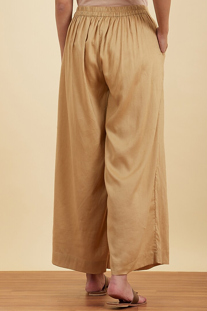 Beige Flared Palazzo Pants by Ritu Kumar at Pernia's Pop Up Shop