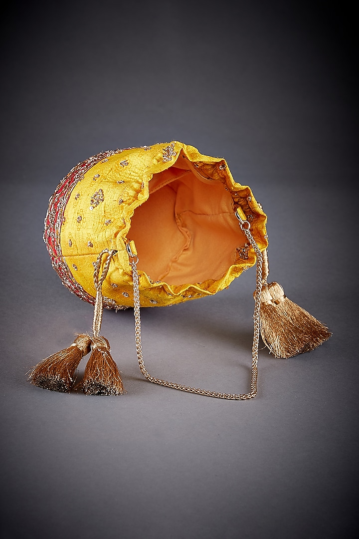Yellow Raw Silk Printed Potli by Ri Ritu Kumar at Pernia's Pop Up Shop