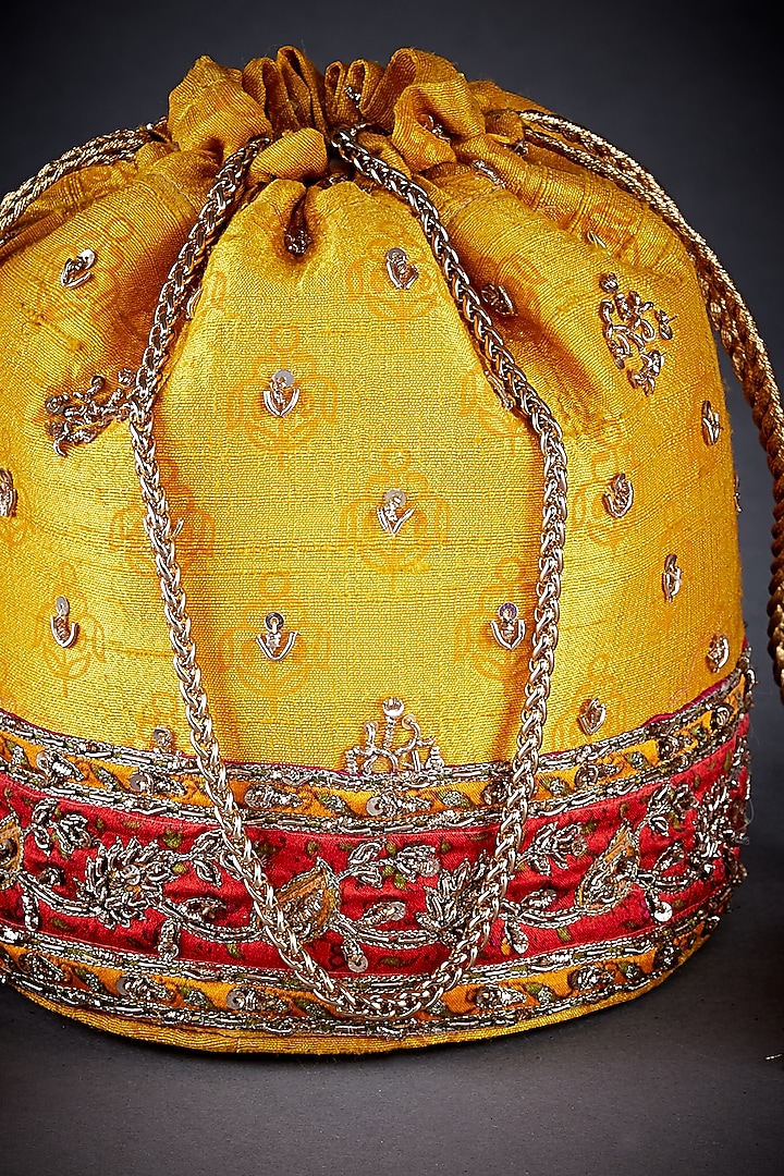 Yellow Raw Silk Printed Potli by Ri Ritu Kumar at Pernia's Pop Up Shop