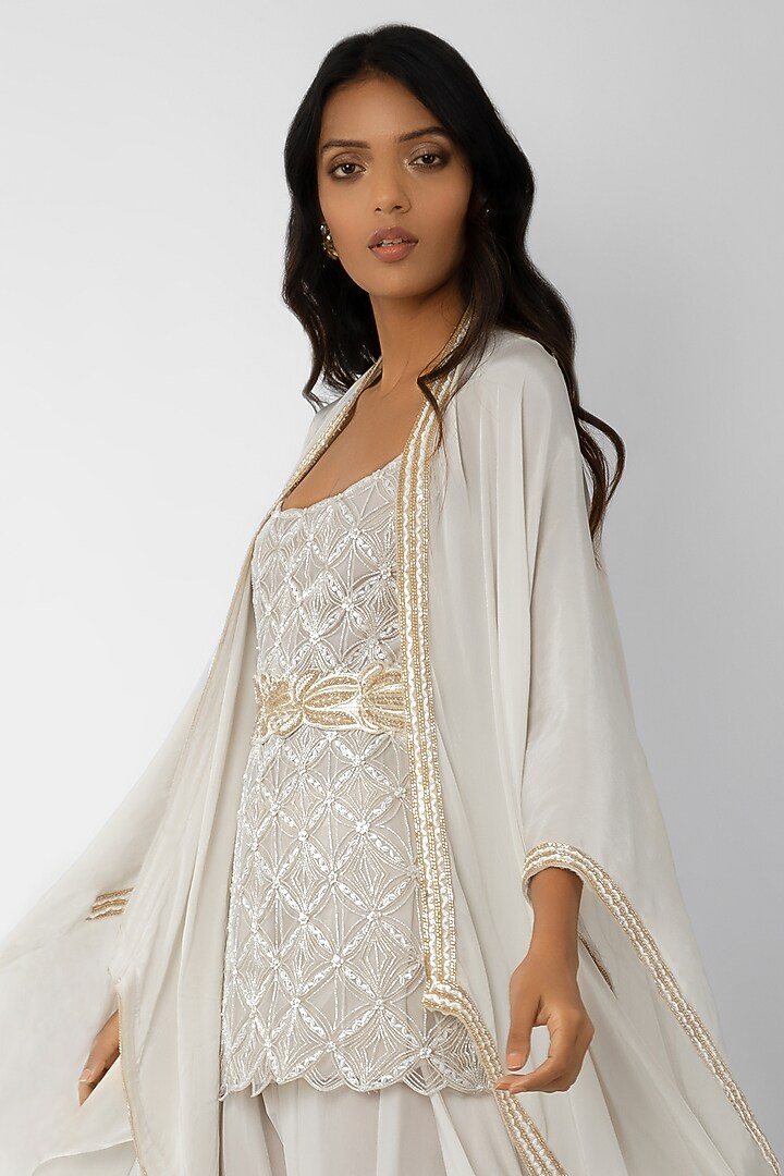 Ivory Crystal Embroidered Kurta Set With Belt & Cape by Ritika Mirchandani at Pernia's Pop Up Shop