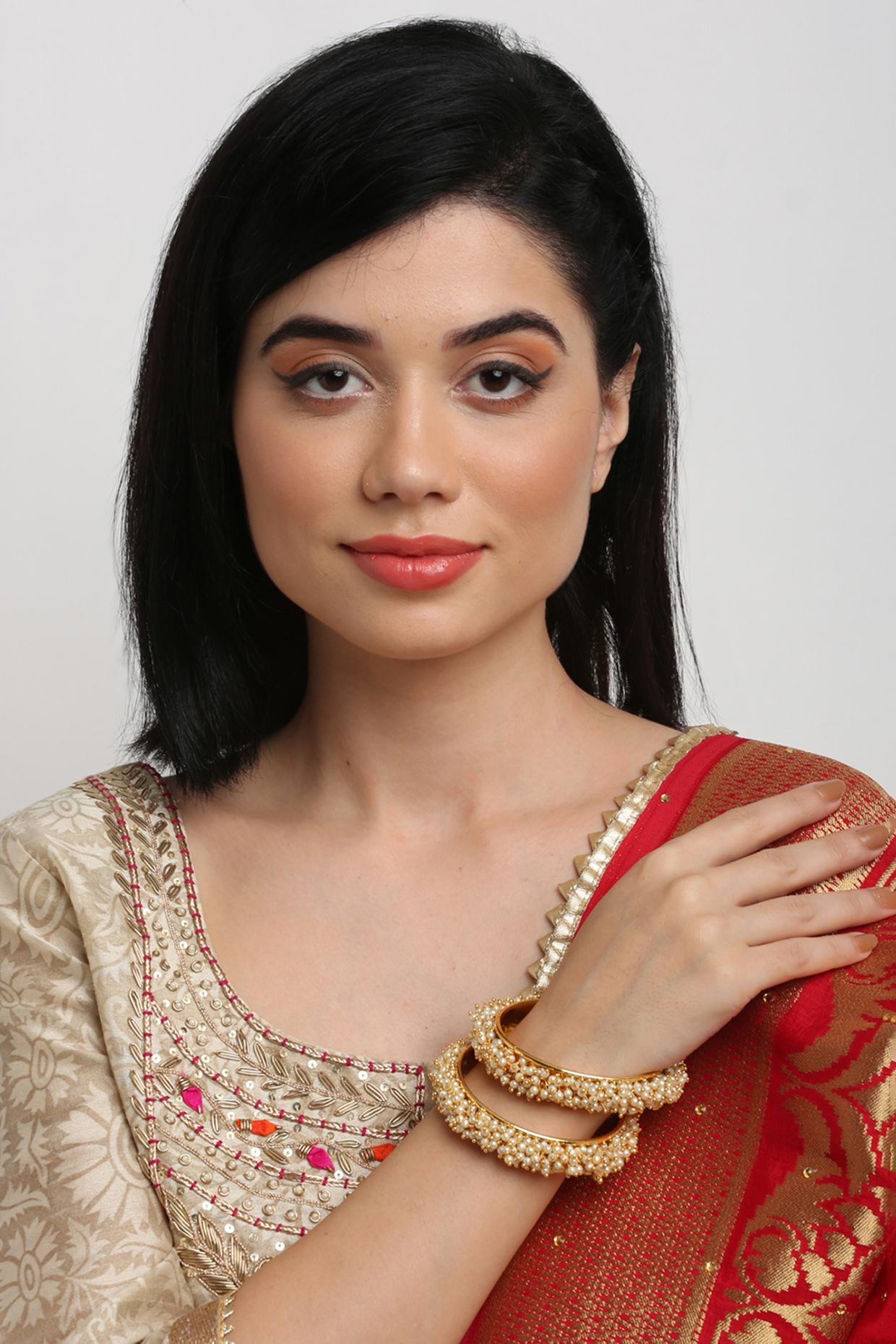 Gold Finish Pearl Bangles (Set of 2) by Ruby Raang at Pernia's Pop Up Shop