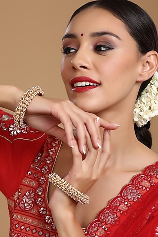 Gold Finish White Kundan Polki Bangles (Set Of 2) by Ruby Raang
