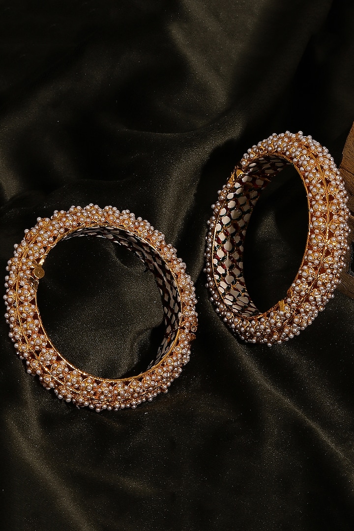 Gold Finish White Kundan Polki Bangles (Set Of 2) by Ruby Raang at Pernia's Pop Up Shop