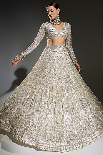 Ivory Net Sequins Embroidered Bridal Lehenga Set by Ruchika Hurria at Pernia's Pop Up Shop
