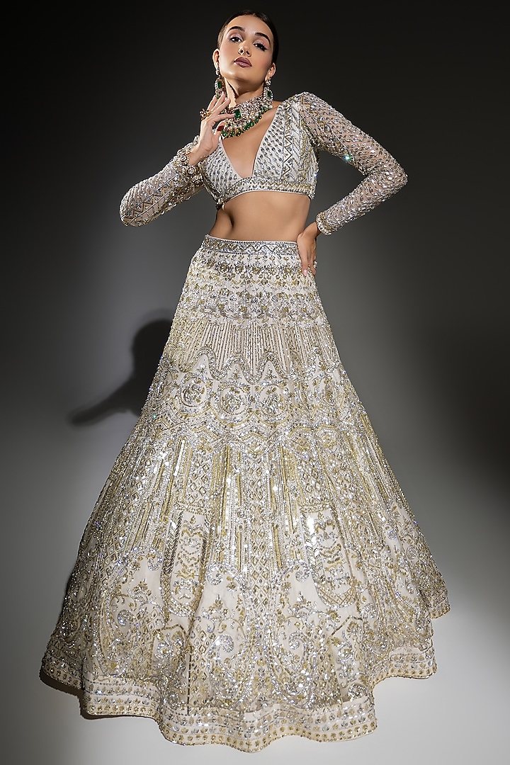Ivory Net Sequins Embroidered Bridal Lehenga Set by Ruchika Hurria at Pernia's Pop Up Shop