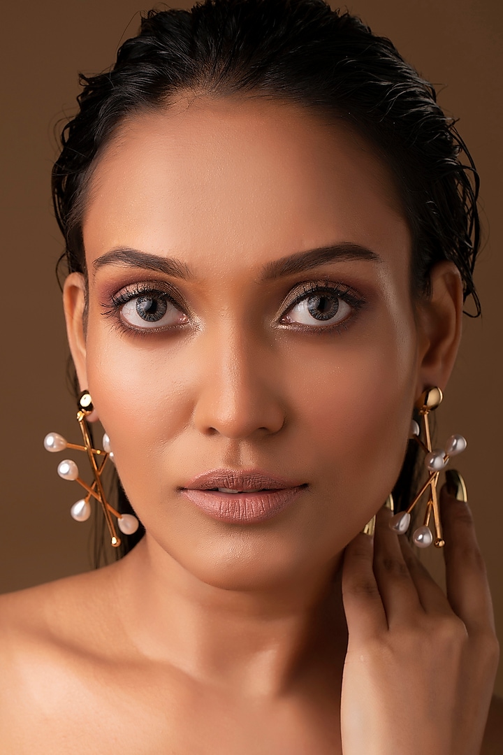 Gold Finish Chandelier Earrings by Ruhheite at Pernia's Pop Up Shop