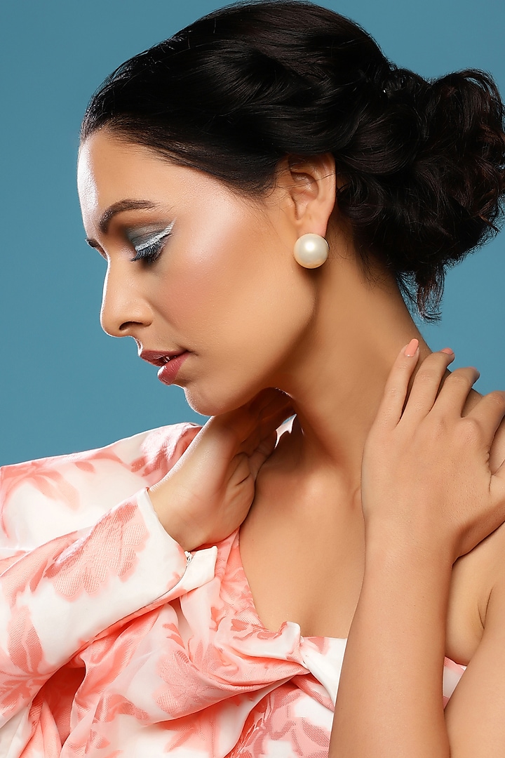 Gold Finish Cream Pearl Stud Earrings by Ritu Singh