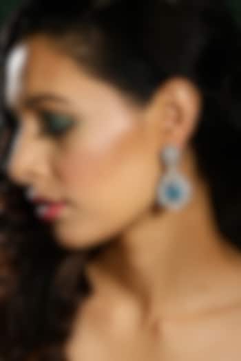 White Finish Sky Blue Zircon Dangler Earrings by Ritu Singh at Pernia's Pop Up Shop