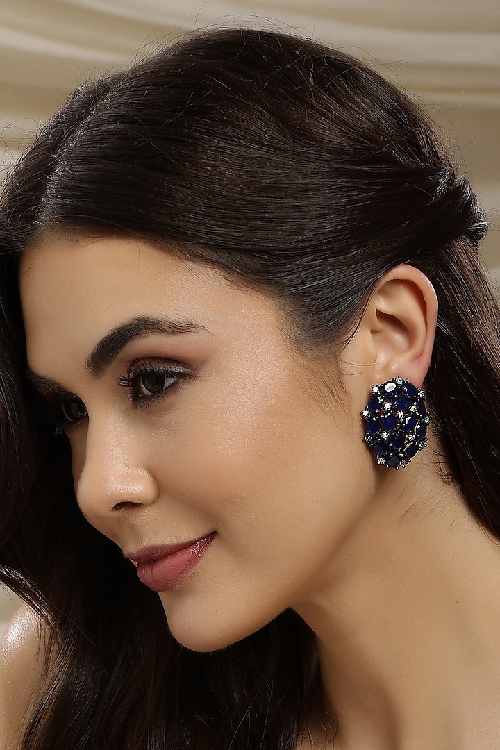 White Finish Blue Zircon Stud Earrings by Ritu Singh at Pernia's Pop Up Shop