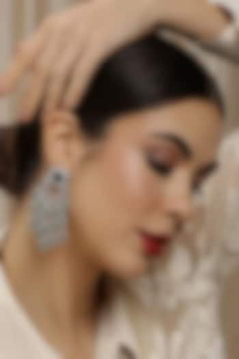 White Finish Zircon Chandelier Dangler Earrings by Ritu Singh at Pernia's Pop Up Shop