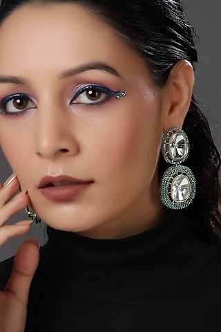White Finish Green Crystal Dangler Earrings by RITU