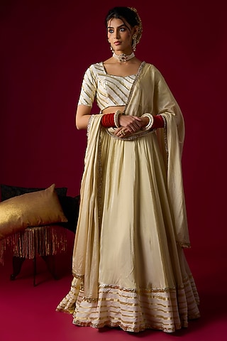 Gold Silk Tissue Lehenga Set by Rayasha Khan
