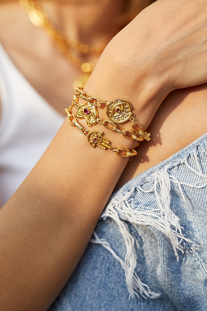 Gold Finish Hamsa Hand Bracelet by Flowerchild By Shaheen Abbas at Pernia's Pop Up Shop