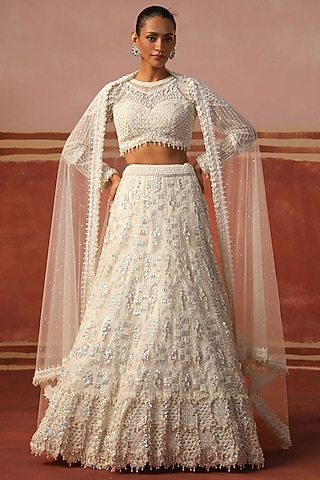Ivory Net Sequin Embroidered Lehenga Set by SABE