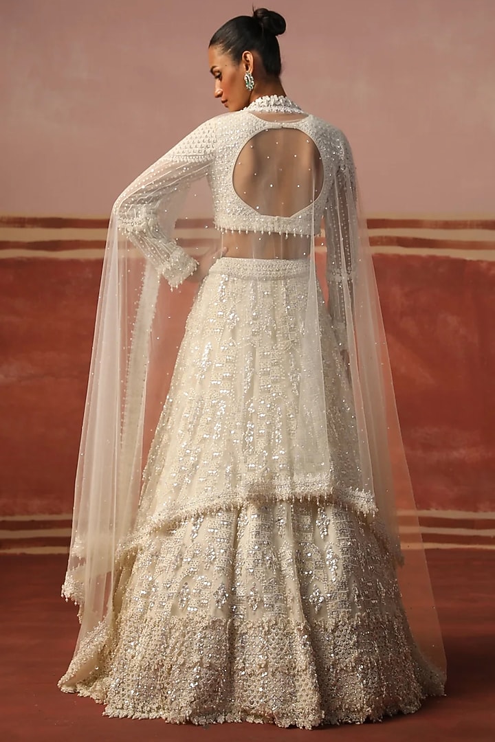 Ivory Net Sequin Embroidered Bridal Lehenga Set by SABE at Pernia's Pop Up Shop
