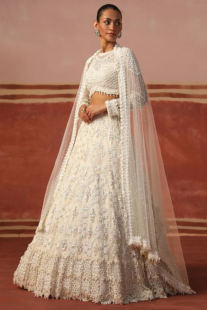 Ivory Net Sequin Embroidered Bridal Lehenga Set by SABE at Pernia's Pop Up Shop